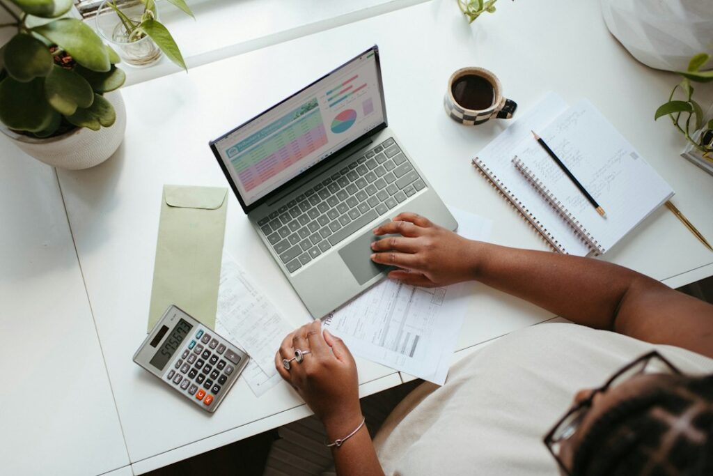 Small business owner working on a laptop at a desk